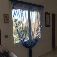 پرده سرمه ای و کرم