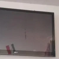 تلوزیون ال جی با میز تلوزیون