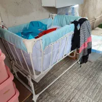 گهواره تخت کنار مادر