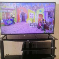 تلویزیون 43 اینچ BLEST و میز تلویزیون