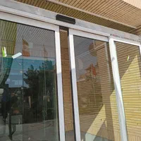 شیشه سکوریت کرکره برقی درب برقی اینه پازل