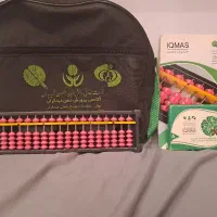 چرتکه همراه با کارت و کیف و دفتر مربوط به آن .