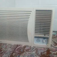 کولر گازی پشت پنجره در حد نو