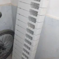 رادیاتور و درب ورودی چوبی