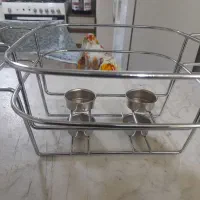 زیر مرغ خوری برای داغ نگر داشتن