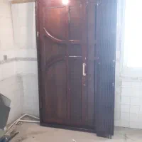 درب ورودی چوبی دولنگه با حفاظ اهنی