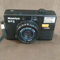 دوبین عکاسی وتلفن رومیزی