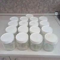 ۱۷ عدد شیشه نوتلا و شمع قرمز