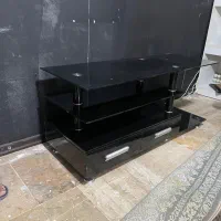 میز تلویزیون شیشه ای مشکی با کشو