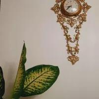 ساعت دیواری .گلدان.گل.میزتلفن برنزی