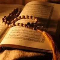 سید بلوچ با سرکتاب قرآن