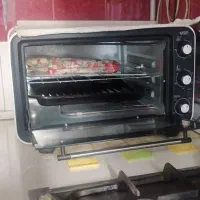 دستگاه فر خانگی سیخ گردون سینی پیتزا داخلش تمیز
