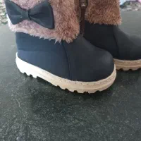 کفش و قنداق نوزاد