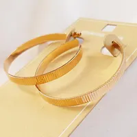 گوشواره نیم حلقه ای خطی با روکش طلا