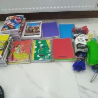 مقداری لوازم التحریر  دفتر و کوله مدرسه