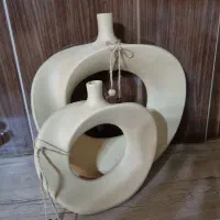 ساعت و گلدان و دیوارکوب و تابلو و عروسک