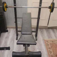 دستگاه بدنسازی خانگی به همراه دمبل و میله