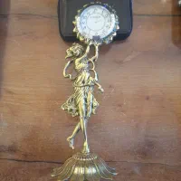 ساعت.مجسمه برنجی