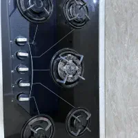 اجاق گاز شیشه ای تو کار درحد نو کم کارکرد