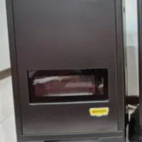 بخاری گازی طرح شومینه ی بزرگ و بخاری معمولی کوچک