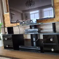 میز تلوزیون شیشه ای مشکی ۴ کشو