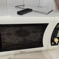 ماکروویو جوجه گردان میدیا در حد نو