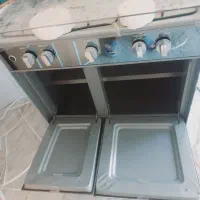 دوعدد هود یک عدد گاز پنج شعله ویک عدد زیرتلویزیون