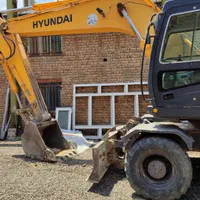 بیل میکانیکی و کامیون کمپرسی