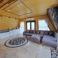 کلبه سوئیسی تک خواب با جکوزی۲نفره تراس دارلب ساحل|اجارهٔ کوتاه‌مدت ویلا و باغ|بندر انزلی, اطبا|دیوار