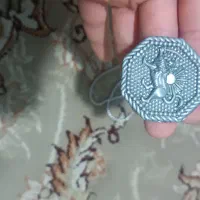 ۱۳تا دستبند یک جفت گوشواره و یک گردنبند شیروخورشید