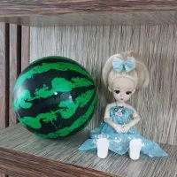 عروسک شیک و زیبا همراه توپ هندوانه ای