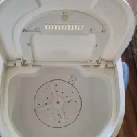 یک عدد لباسشویی کودک و یک عدد کالسکه هردو باهم