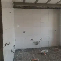 کاشی کاری و برق کشی ساختمان