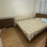 تختخواب دونفره همراه با خوش‌خواب و دو عدد پاتختی