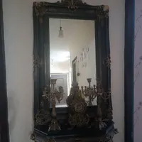 آینه و کنسول و ساعت و شمعدان