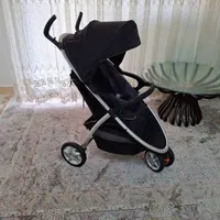 کالسکه کریر evenflo و تشک بازی و روروعک ست ۴ تکه