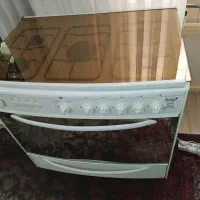 اجاق گاز سفید شیشه طلایی ت ک ن و ایتالیایی