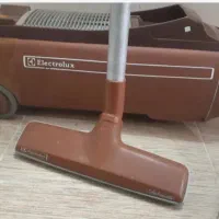 جاروبرقی الکترو لوکس و لپ تاپ سوزیکی