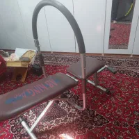 دستگاه دراز و نشست ایرپرو بهمراه حلقه کنار دیوار