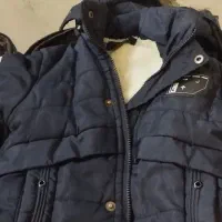 کاپشن|کفش و لباس بچه|قم, قلعه کامکار|دیوار