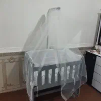 گهواره کنار تخت مادر
