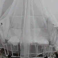 گهواره کنار تخت مادر