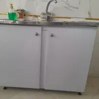 درب آهنی .میز تلویزیون. کابینت و ابچکان