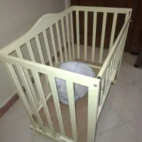 گهواره کنار تخت مادر