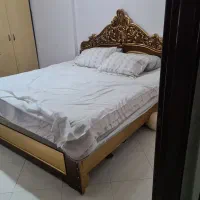 تخت خواب دونفره تمام چوب گردو