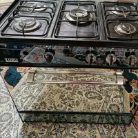 اجاق گاز سالم ..فقط یکم شیشه ش ترک خورده