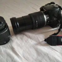 دوربین کانن مدل 1100 همراه با لنز 18-200