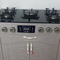 اجاق گاز ابچکان ظرفشویی ومیز تلویزیون