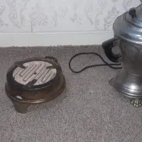 سماور برقی. کمکی دوچرخه. گاز المنتی برقی