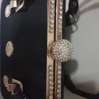کیف مجلسی|کیف، کفش، کمربند|قم, بنیاد|دیوار